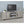 Conifer - TV Stand With Adjustable Shelves - Gray