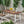 Equilibrium Outdoor Dining Table with Wooden Frame and Slat Top