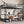Queen Over Twin XL Metal Bunk Bed with Desk and Shelves