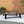 Cloud Outdoor Bench With Acacia Wood Frame And Slat Panel Design