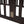 Twin Size Floor Bed Frame With Fence And Door - Walnut