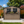 6x9 FT Outdoor Metal Storage Shed with Window & Flower Rack