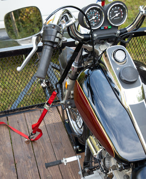 Camco Motorcycle Wheel Chock Mount with Handlebar Straps & Universal Tire Fit