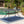 Enchantia Outdoor Rectangular Dining Table with Weave Tabletop and Flared Legs - Copper