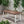 Equilibrium Outdoor Dining Table with Wooden Frame and Slat Top