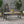 Equilibrium Outdoor Dining Table with Wooden Frame and Slat Top