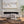 Ivory Fabric Storage Bench with Rolled Arms