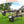Foldable Camping Table Collapsible Picnic Aluminum Alloy Grill Stand BBQ Table with 66LBS Max Load Adjustable Height 2 Side Wing Trays Storage Net