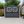 6x9 FT Outdoor Metal Storage Shed with Window & Flower Rack