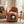 Orange Pet Friendly Chair with Hidden Pet Nook, Convertible Stool, and Storage Seat