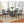 Lavon - Oval Extension Leaf Dining Table With Built In Storage - Gray