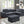 Haris - Sleeper Sofa Sectional With Adjustable Headrest And Storage Ottoman - Dark Gray