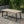 Equilibrium Outdoor Dining Table with Wooden Frame and Slat Top
