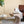 16.3x12.2x22.6 Modern Sculptural Arched Side Table with Faux Travertine Finish