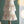 Fringes Embellished Cone With Wooden Base