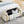 Elegant Upholstered Storage Bench With Cylindrical Arms And Iron Legs,