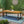 Equilibrium Outdoor Dining Table with Wooden Frame and Slat Top