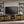 Ensata II - TV Stand - Rustic Oak / Black