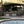 KoKoMo Bermuda Kitchen BBQ Island with Built-In TV, Fire Pit & Bar for Ultimate Outdoor Entertaining