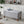 Upholstered Ottoman With Storage And Rivet Trim