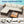 L-Shaped Patio Set With Cushions And Storage Table
