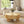 Nebula 35.5' Round Pillar Leg Coffee Table Warm Natural Brown Burl Wood