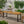 Equilibrium Outdoor Dining Table with Wooden Frame and Slat Top