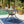 Enchantia Outdoor Square Dining Table with Weave Tabletop and Flared Legs - Copper