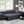 Haris - Sleeper Sofa Sectional With Adjustable Headrest And Storage Ottoman - Dark Gray