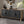 Black Carved Symmetrical Design Door And Wood Coloured Frame TV Stand