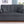 Cody II - Convertible Sleeper Loveseat With Cup Holder, Charging Ports and Pocket - Dark Gray