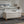 Upholstered Ottoman With Storage And Rivet Trim