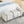 Elegant Upholstered Storage Bench With Cylindrical Arms And Iron Legs,