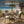 Four Seasons Courtyard Palermo Slat Top Dining Table with Umbrella Hole, Gray - TRAPSKI
