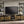 Ensata II TV Stand - Rustic Oak / Black
